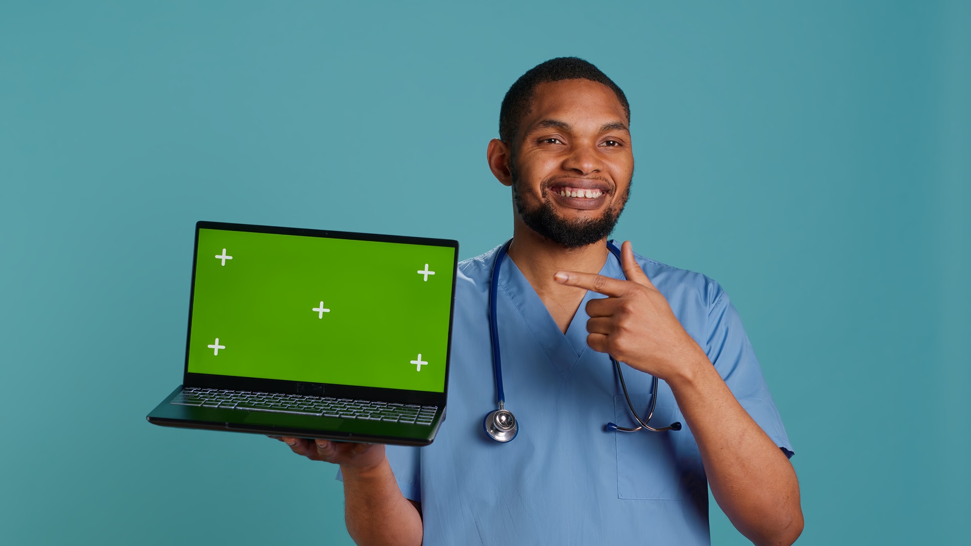 Physical therapist holding up laptop showing graphic against note cloning